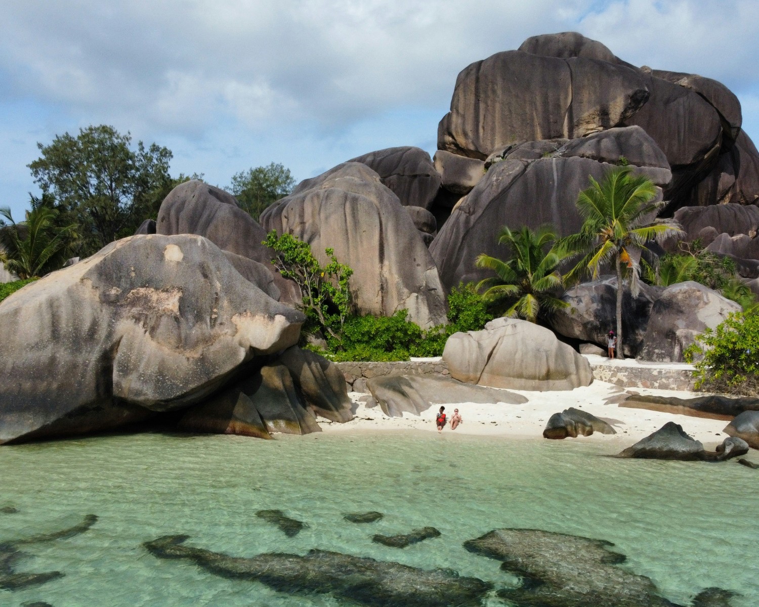 Turquoise waters and pristine white sand of Seychelles beaches