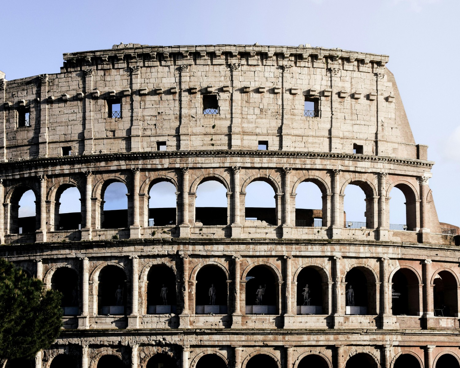 Colosseum in evening light showcasing ancient Roman architectural mastery