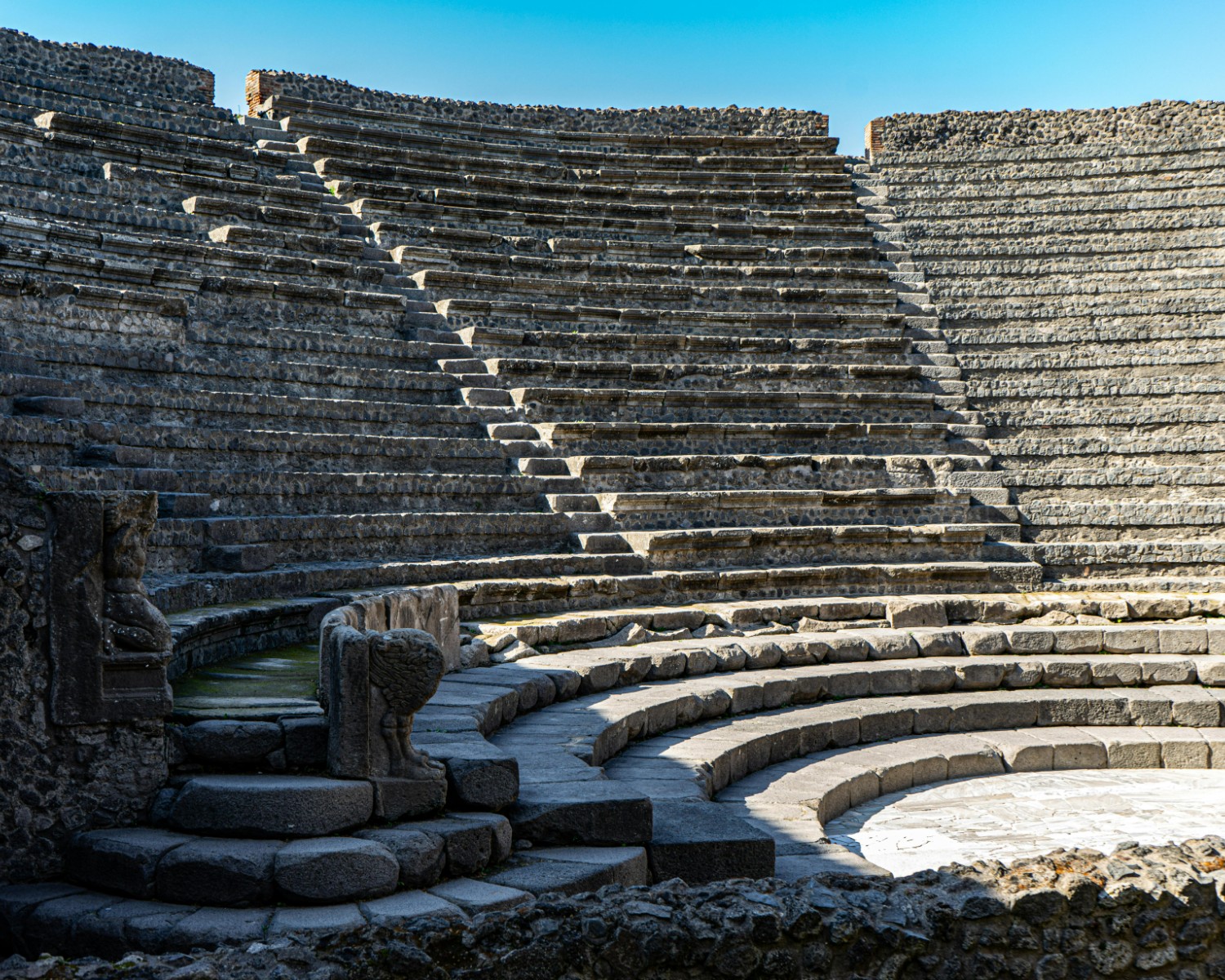 Pompeii amphitheater and forum with intact seating and architectural remains