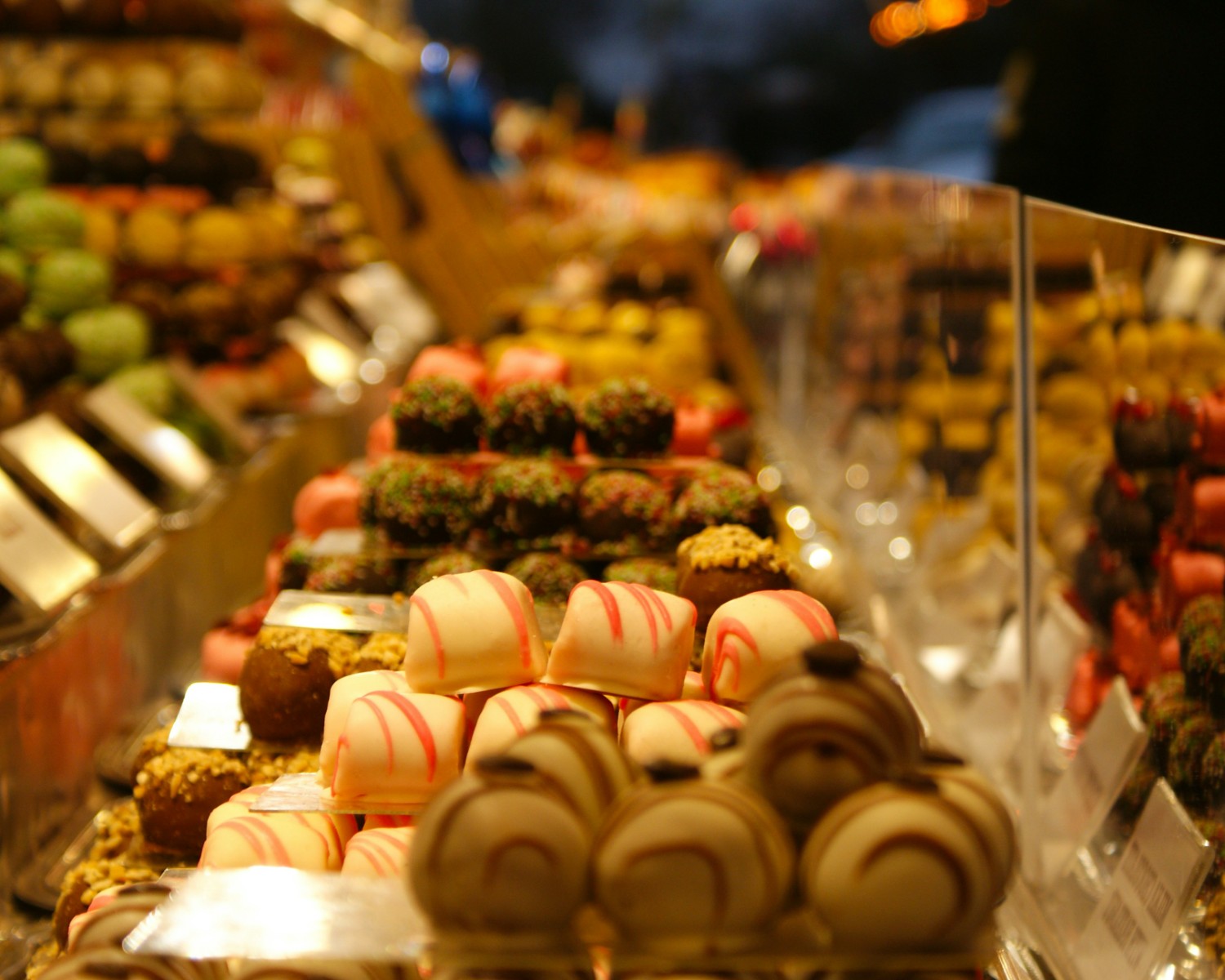 Swiss chocolate varieties from premium brands showcasing pralines, truffles, ganaches