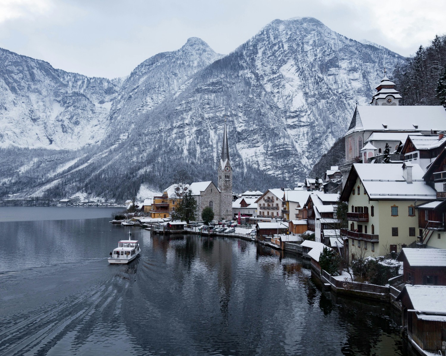 Hallstatt village reflected in pristine lake