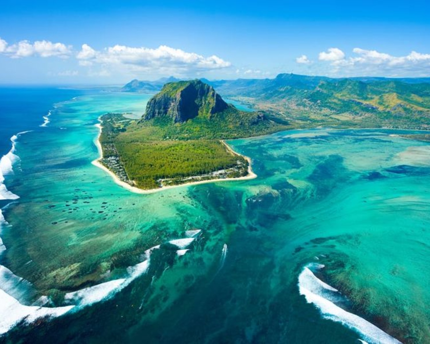 Le Morne Brabant rising from turquoise lagoon
